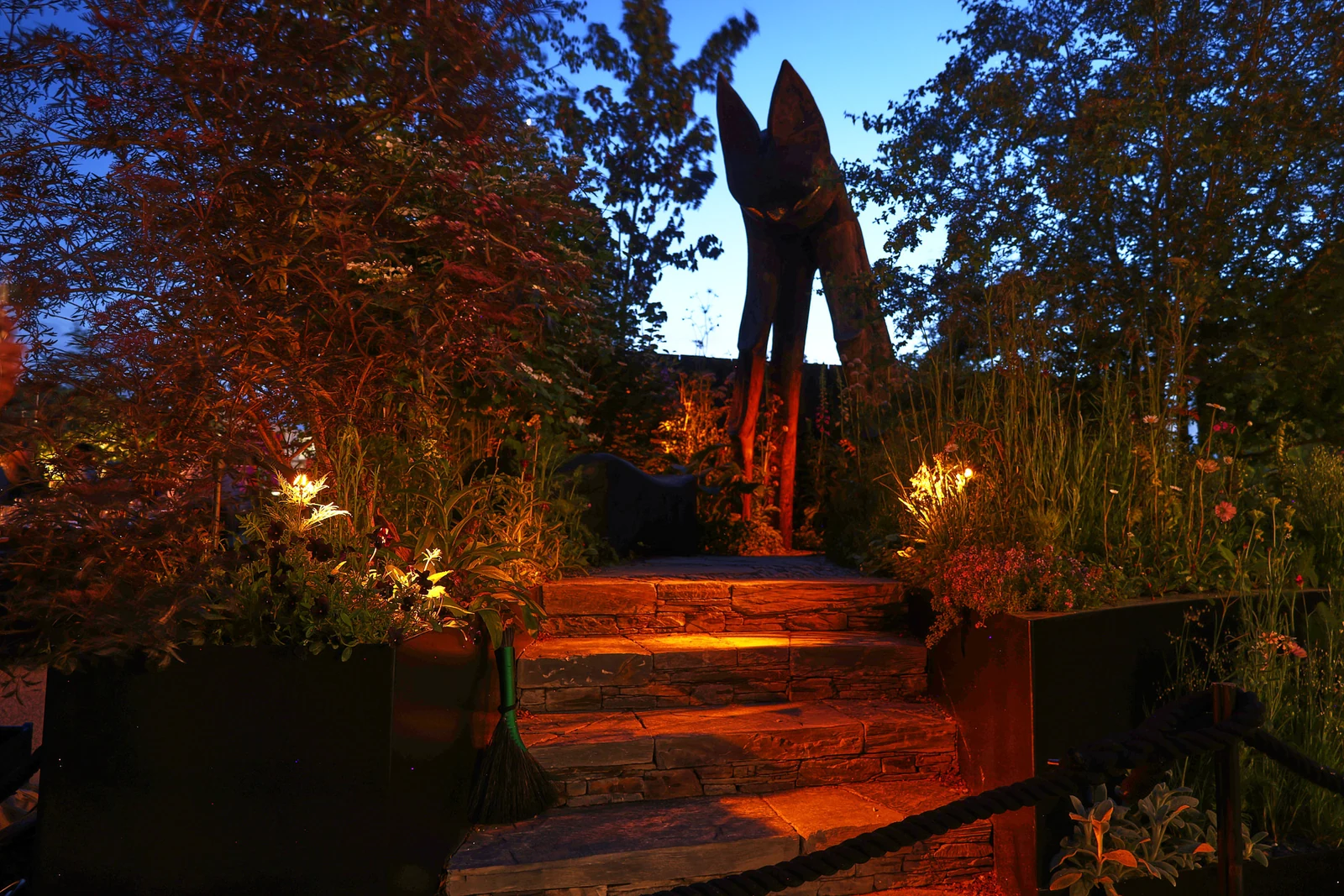 The Nocturnal Garden at Chelsea 2026, with illuminated steps beneath a bat sculpture